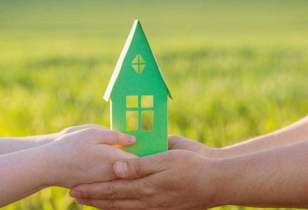 stock-photo-paper-house-in-hand-outdoor